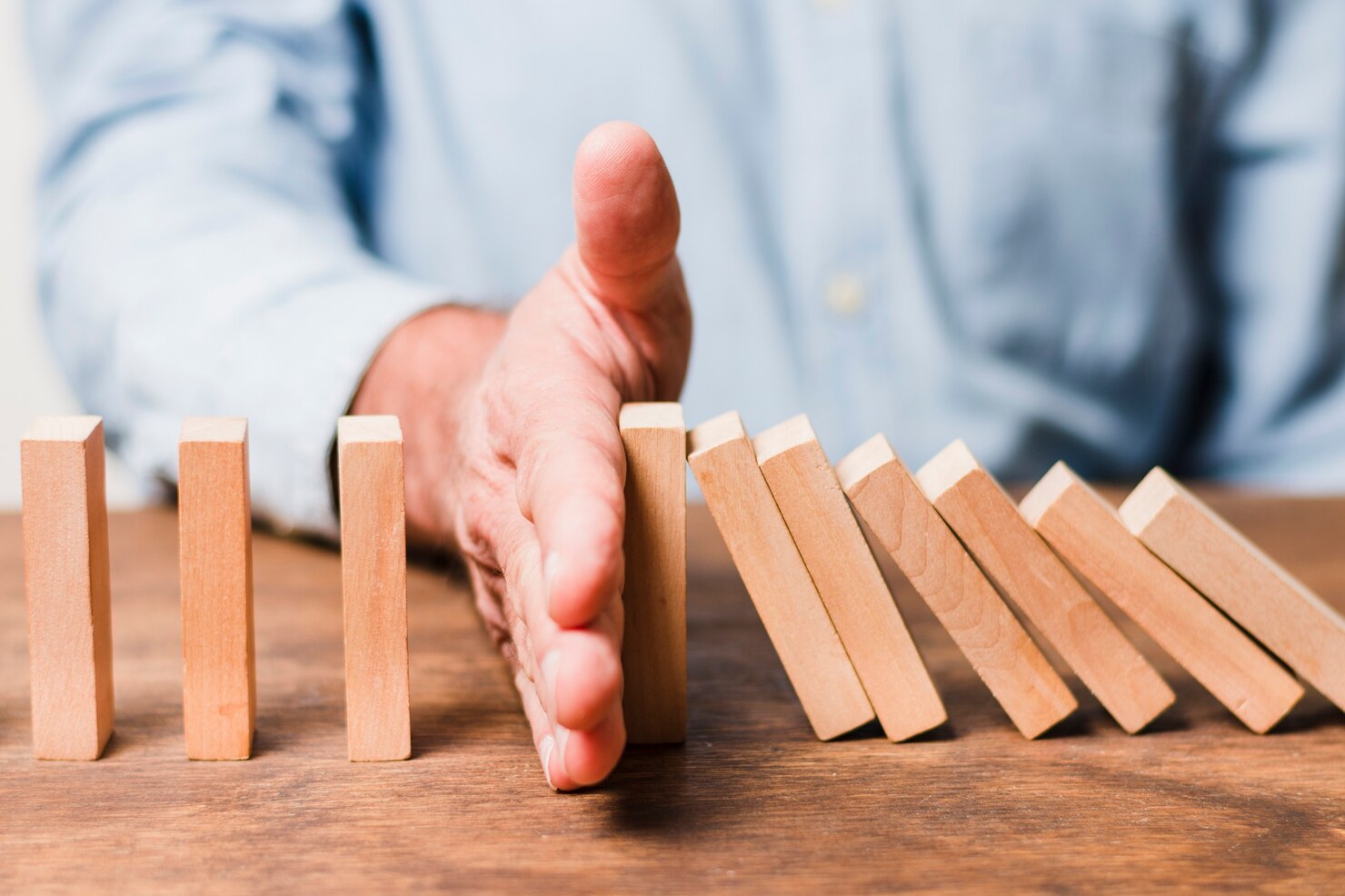 businessman-using-wooden-pieces_23-2148148372.jpg