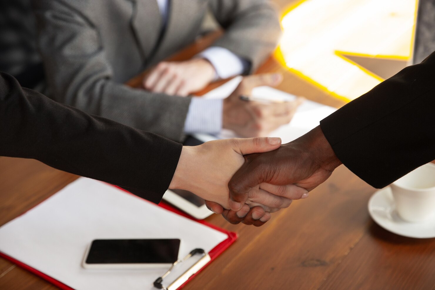 close-up-businessmen-shaking-hands-conference-room_155003-15581.jpg